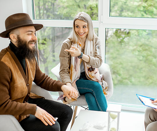 intentional-wellness-mental-health-psychotherapy-west-virginia-consulting Couple talking with Dolly Sullivan about Mental Health and Psychotherapy